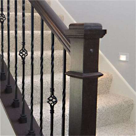 View of staircase with wooden banister