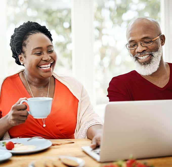 Couple at breakfast laughing