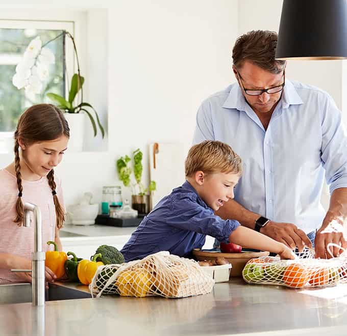 Dad and kids making dinner