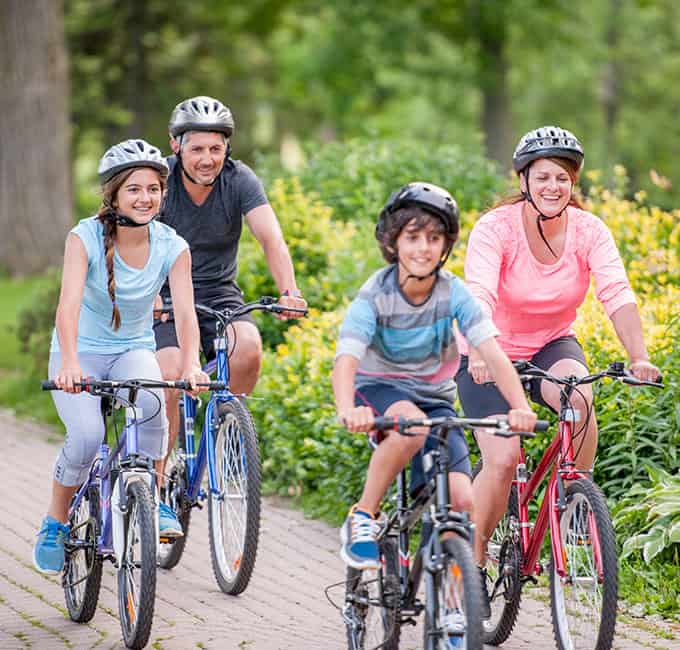 Family of four biking