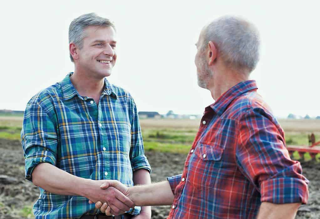 Man shaking hands with a farmer
