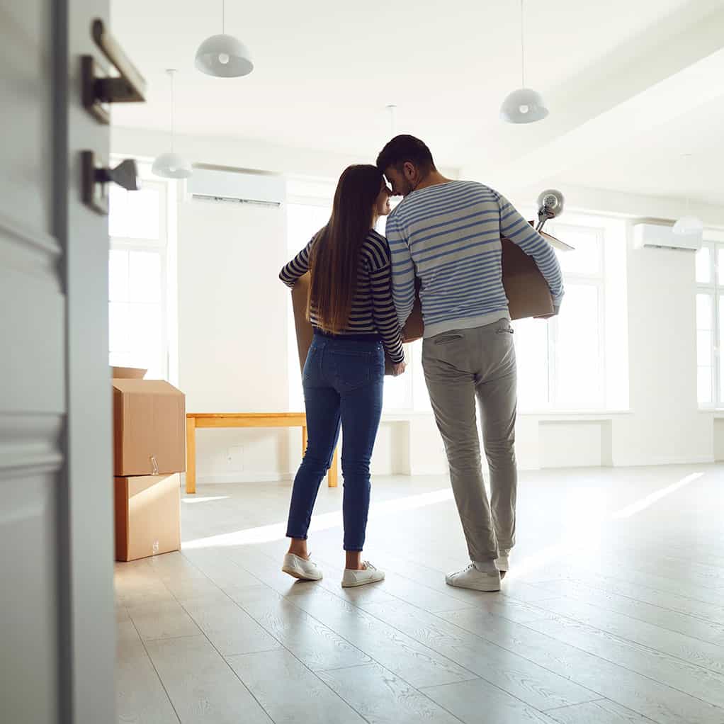 Happy couple moving into new home